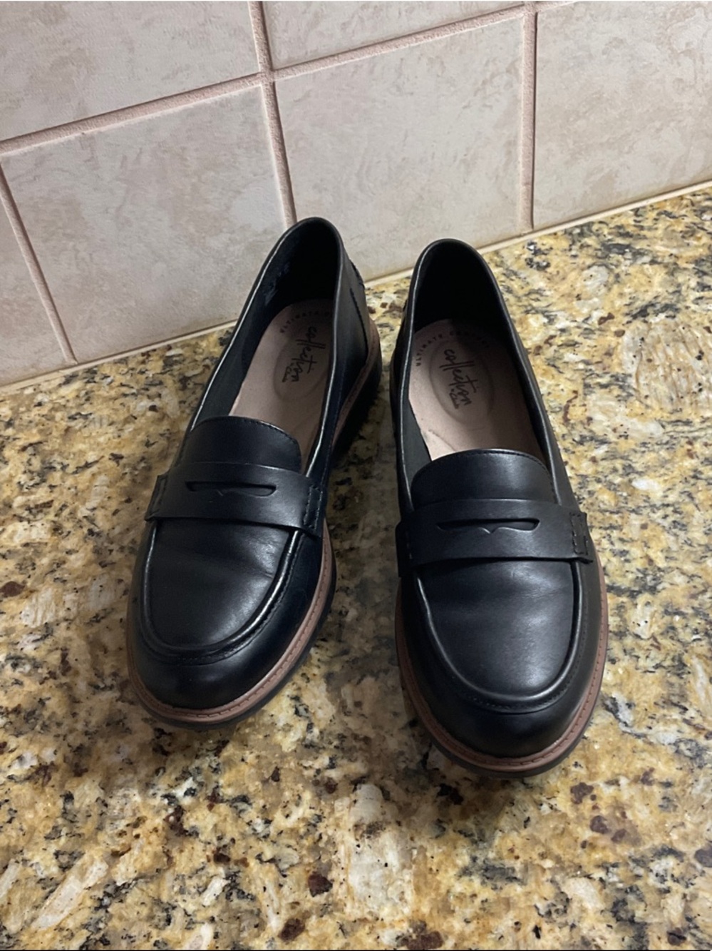 Clarks Black Leather Penny Loafers with Brown Trim Sole